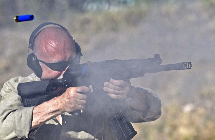 Behind the smoke: a series of quick shots from a 12/76 combat shotgun. A very convincing argument for anyone