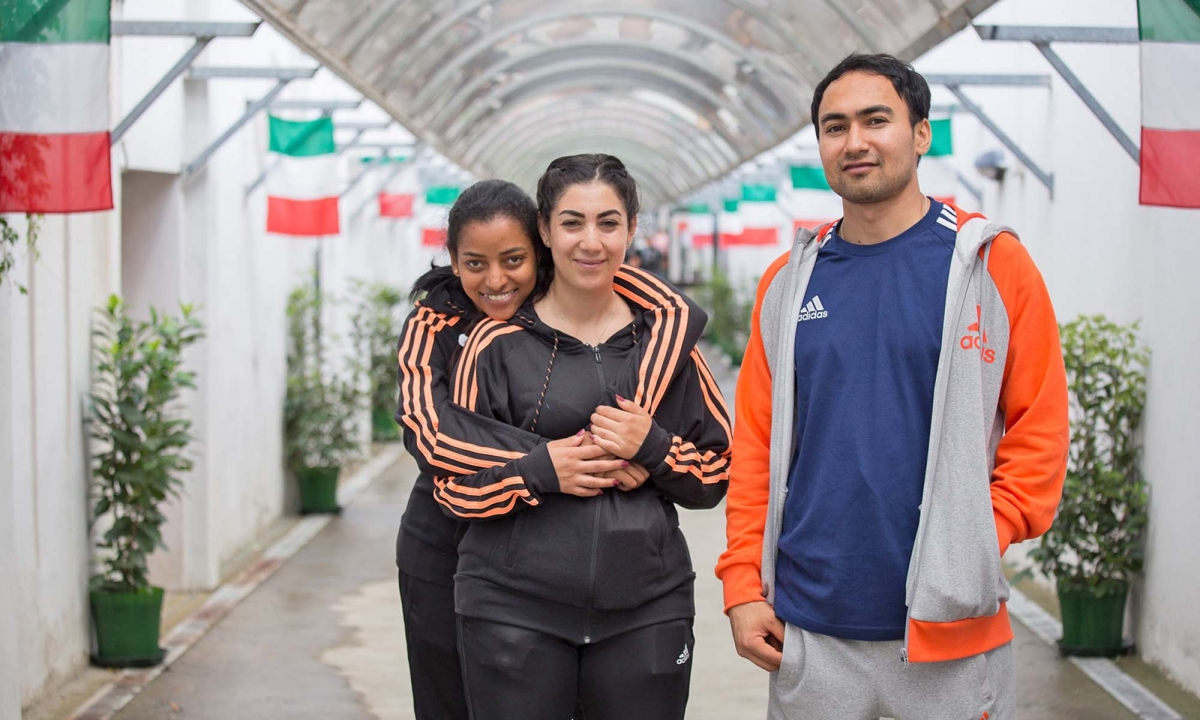Right to left: Mahdi, age 22 from Afghanistan; Khaoula, age 30 from Arabia; and Luna, age 25 from rural Africa are the three athletes selected by Campriani for his project