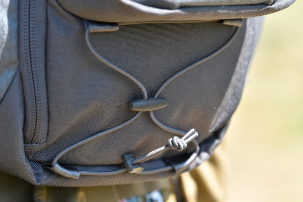 Detail of the retention cord underneath the front pocket 