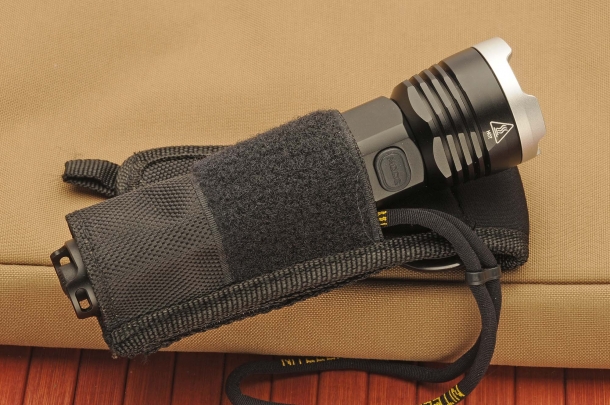 The flashlight with its belt holster