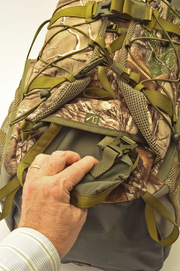 The rifle buttstock support pouch is inside the front flap