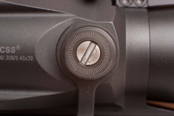 A set of capped turrets provide a 60-MOA reticle adjustment range, both in windage and elevation