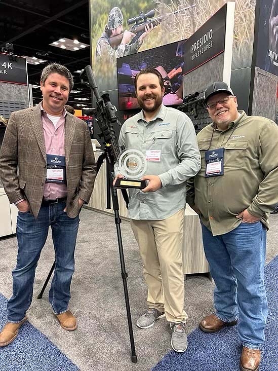 James Sellers, Founder and CEO of Sightmark (center) receiving the NRA's Golden Bullseye Award for the 2023 Optic of the Year