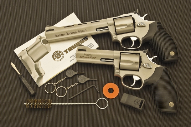 The two revolvers pictured with the factory-issued documents and accessories