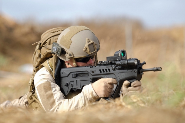 An operator fires the baseline Tavor TAR-21 bull-pup assault rifle