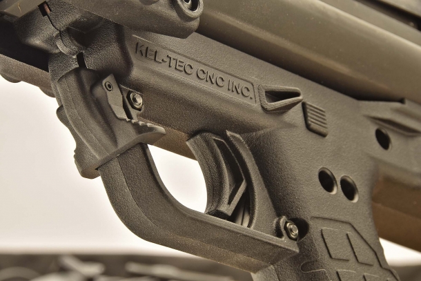 A close-up of the trigger area of the KSG; the lever in front of the trigger guard is the disconnector