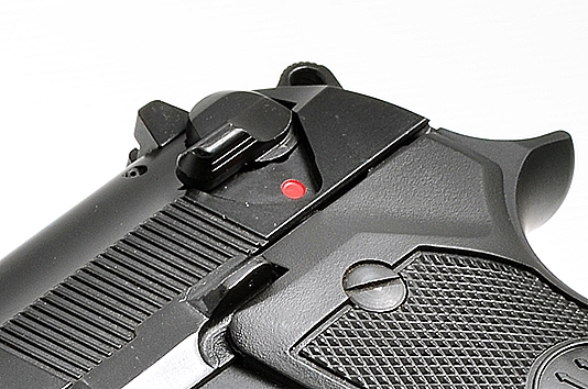 A close-up of the decocking lever on a Beretta M92-FS pistol